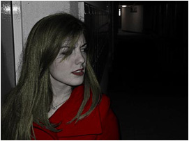 While doing so she looks around once more to see if anyone is there.