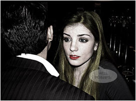 But then her face suddenly changes from a smile to that of shock