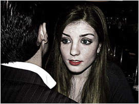 She has seen something or someone behind David, and she is visibly frightened